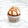 Carrot Cake Cupcake with cream cheese buttercream, caramel drizzle and toffee pieces