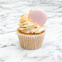 Strawberry macaron cupcakes with strawberry buttercream and a pink macaron