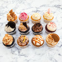 12 Mixed Cupcakes with different toppings, including macarons and Oreo biscuits