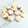 White and Gold Cupcake Mix with ivory buttercream, gold sugar pearls and macarons
