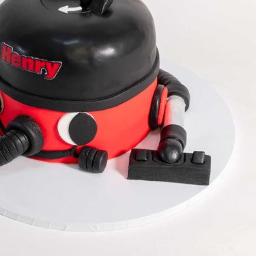 Red Henry Hoover Cake with fondant eyes, smile and hose