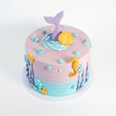Mermaid Cake with lilac to aqua buttercream, a mermaid tail, gold sea decorations and buttercream bubbles