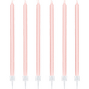 Six blush pink taper cake candles with white holders