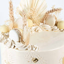 8 inch Dried Grasses Cake with buttercream swirls, white macarons, dried grasses and gold leaf