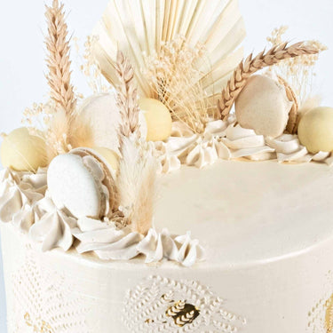 8 inch Dried Grasses Cake with buttercream swirls, white macarons, dried grasses and gold leaf