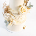 Boho Wedding Cake with ivory buttercream, a cream rose, dried grasses, eucalyptus and ivory macarons