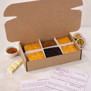 Sample Taster Box with six cake slices, passionfruit and white chocolate, and a flavour card