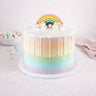 Rainbow Cake with pastel buttercream, white chocolate drip and a sugar rainbow on top