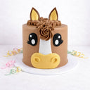 Horse Face Cake with chocolate buttercream, a fondant horse face and piped mane, with pastel ribbons
