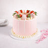 Gluten friendly Free From Strawberry Macaroon Cake with pink buttercream, white drip, strawberries and macarons