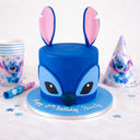 Stitch Cake, a two tier fondant cake shaped as Stitch with big ears and a 7th birthday message