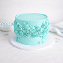 Gluten friendly Free From Ripple Cake with turquoise buttercream, piped rosettes and swirls