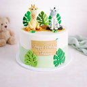 Safari Cake with fondant animals and leaves and a happy birthday plaque