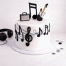 Music Cake with fondant music notes, a treble clef, a guitar and an amp