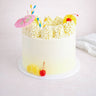 8 inch Cocktail Cake with white buttercream, rosettes, pineapple, cherries, paper straws and a cocktail umbrella