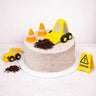 Mini Digger Cake decorated as a building site with a toy digger, traffic cones and chocolate soil