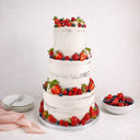 Three tier semi naked Fresh Berry Wedding Cake with fresh berries and herbs