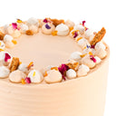 Carrot Cake with labels showing the carrot sponge, mascarpone buttercream, biscuit crumb and petals