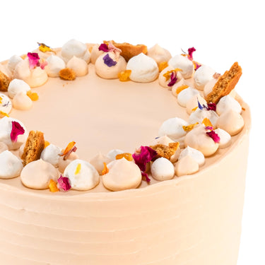 Carrot Cake with labels showing the carrot sponge, mascarpone buttercream, biscuit crumb and petals