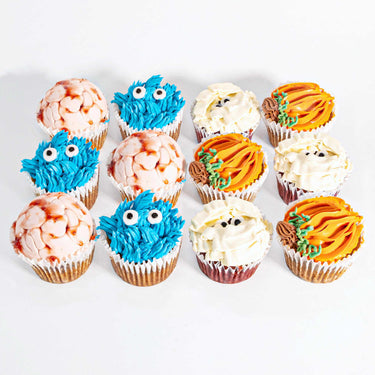 Halloween Cupcakes with piped brain, monster, mummy and pumpkin designs