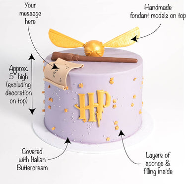 Free From Harry Potter Cake with lavender buttercream, a gold logo, snitch, wand, map and message space