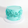 Ripple Cake with smooth aqua buttercream and piped swirls, rosettes and stars