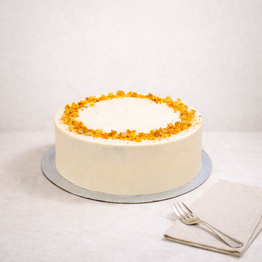 Carrot Cake with orange buttercream and golden honeycomb pieces