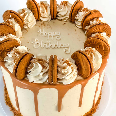 Vegan Free From Biscoff Cake with Biscoff buttercream, caramel drip, piped swirls and Biscoff biscuits
