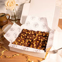 Box of Chocolate and Hazelnut Brownies with a mug, a rose and gold ribbon