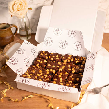 Box of Chocolate and Hazelnut Brownies with a mug, a rose and gold ribbon
