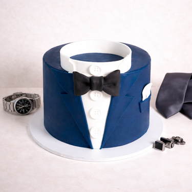 Free From Suit Cake decorated as a dinner jacket, surrounded by men's accessories