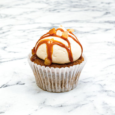Carrot Cake Cupcake with cream cheese buttercream, caramel drizzle and toffee pieces