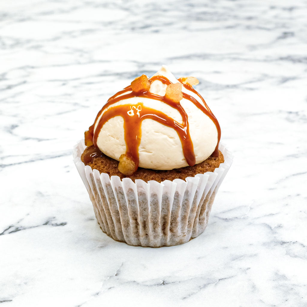 Carrot Cake Cupcake with cream cheese buttercream, caramel drizzle and toffee pieces
