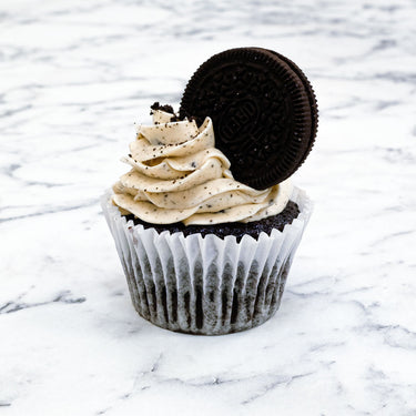 Oreo Cupcake with cookies and cream buttercream and an Oreo biscuit on top
