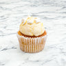 Lemon Cupcake with lemon buttercream, meringue pieces and lemon drizzle, on marble