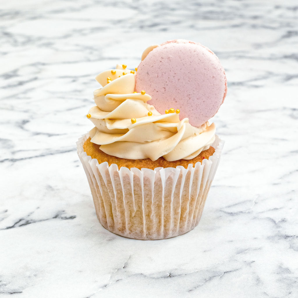 Strawberry macaron cupcakes with strawberry buttercream and a pink macaron