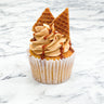 Salted Caramel Cupcake with caramel buttercream, caramel drizzle and stroopwafel pieces, on marble