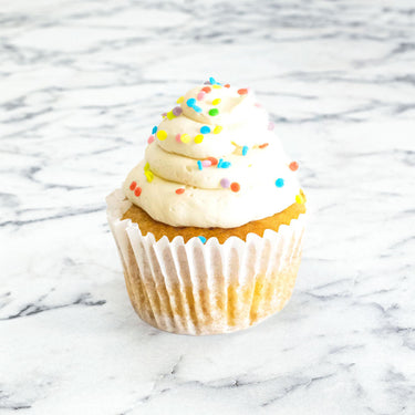 Vanilla cupcakes with vanilla buttercream and sugar sprinkles