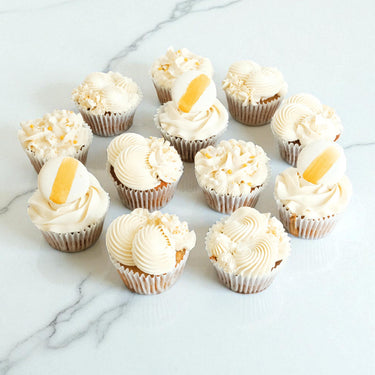 White and Gold Cupcake Mix with ivory buttercream, gold sugar pearls and macarons