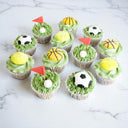 12 Sports Cupcakes with green buttercream grass and fondant footballs, basketballs, tennis balls and golf flags