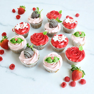 Valentines Cupcakes with pink and red buttercream roses and chocolate dipped strawberries