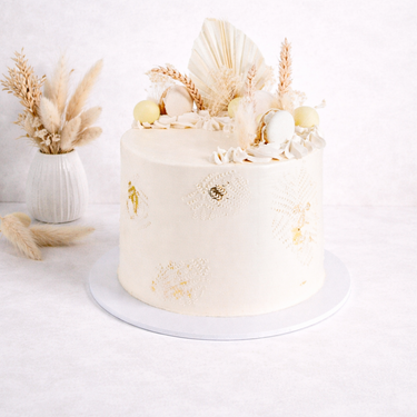 Dried Grasses Cake with off white buttercream, macarons, truffles and dried grasses
