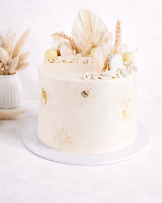 Dried Grasses Cake with off white buttercream, macarons, truffles and dried grasses