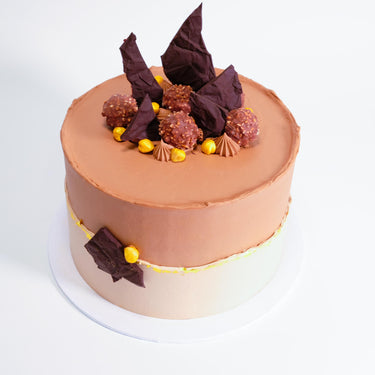 Ferrero Rocher Cake with two tone chocolate buttercream, chocolate shards, truffles and gold pearls