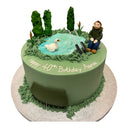 Custom 40th birthday cake with a fondant pond scene, a man fishing, a swan and bulrushes