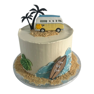 Custom beach cake with a camper van topper, palm trees, a sea turtle and edible sand