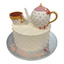 Custom birthday cake with a fondant teapot and teacup and peach polka dots