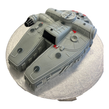 Custom 3D cake shaped like a sci fi spaceship, covered in fondant