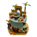 Custom two tier pale blue theme park cake with printed characters and fondant decorations