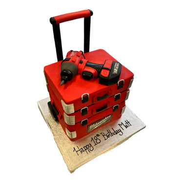 Custom 18th birthday cake made to look like red tool cases with a cordless drill on top